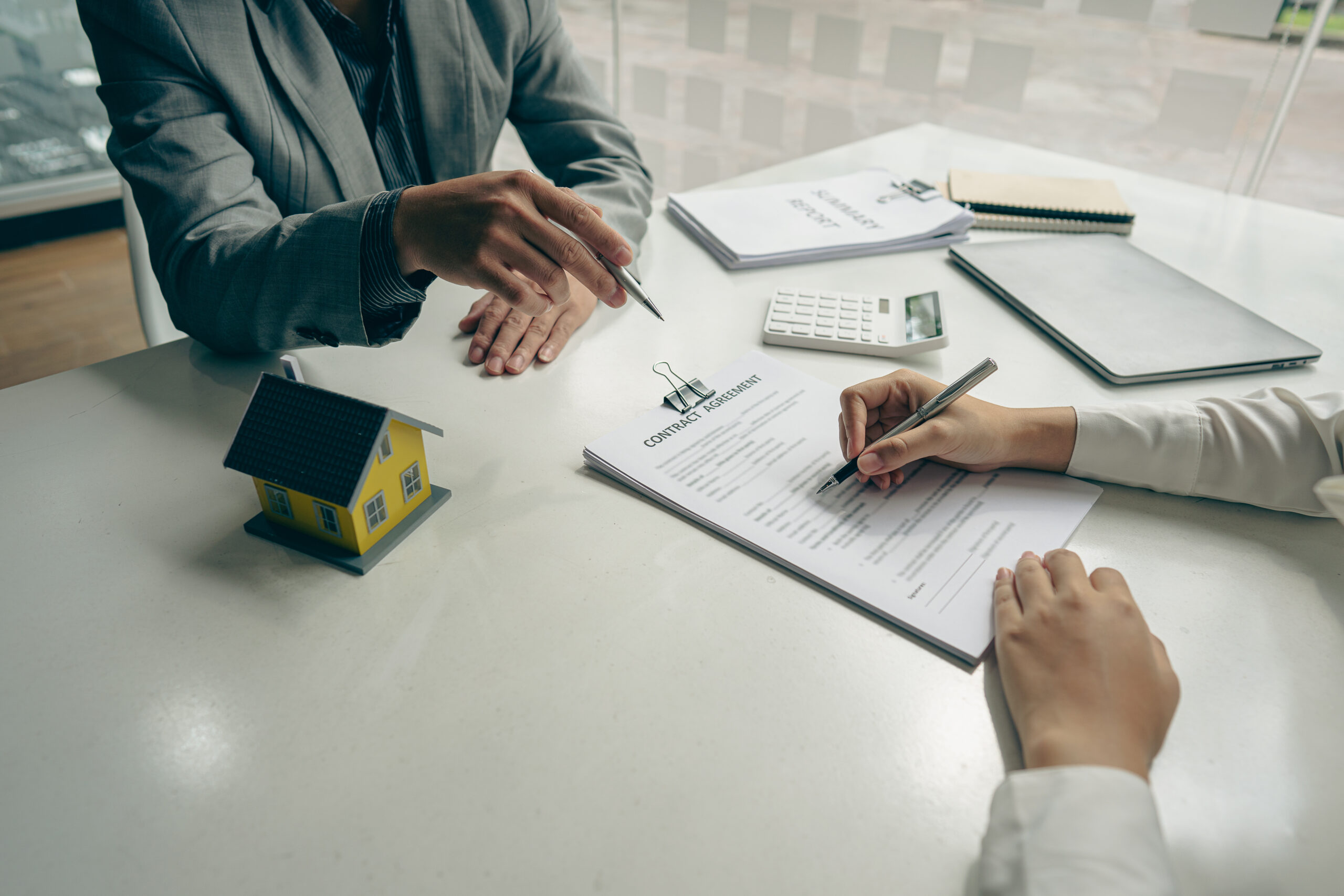 Image of two people going over paperwork