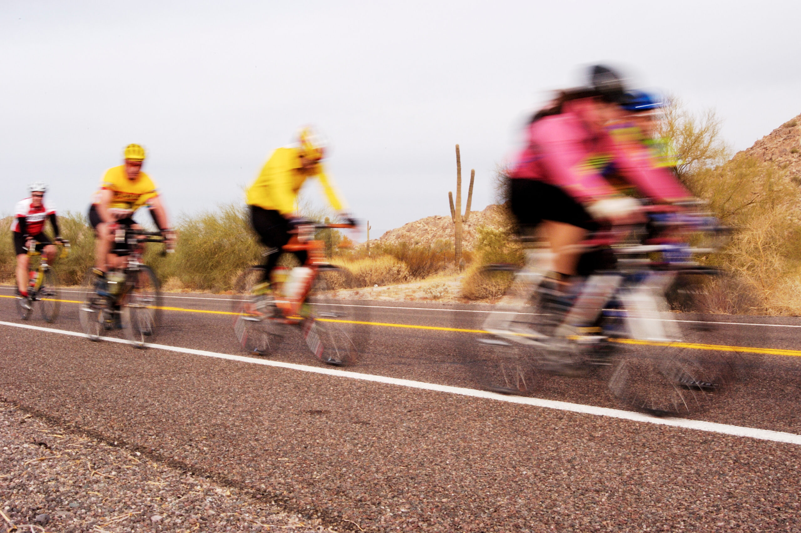 Competitors in a bike race through the desert.